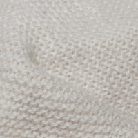 Cashmere knit, close up - fine goat-hair fibre spun and knitted, warmer than wool at half the thickness